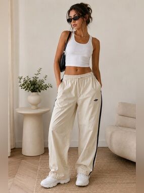 Cream Track Pants with Navy/ Black Side Detail.